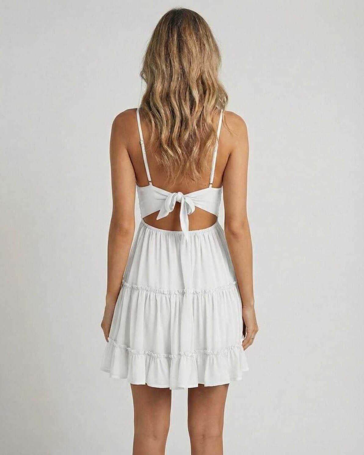 Back view of the Luna Mini Dress by RAMBLION with lace bodice and flowy tiered skirt.