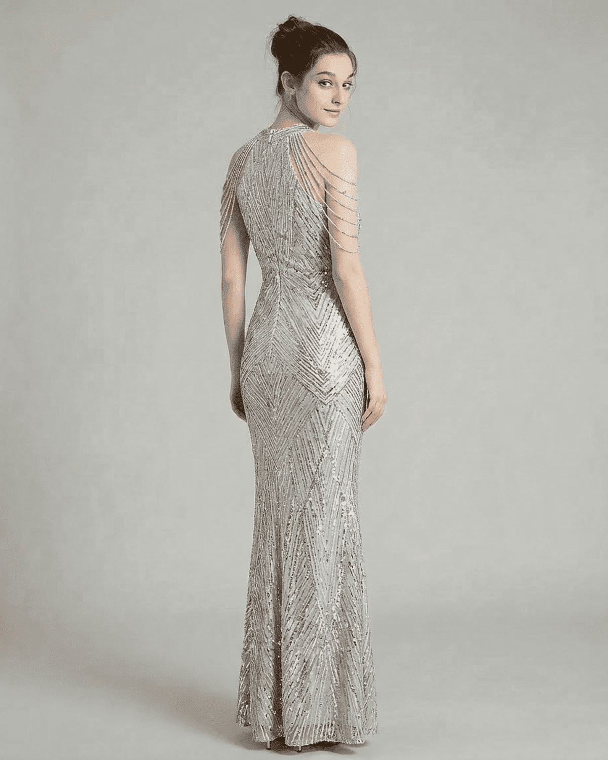 Luxe Maxi Dress - Back view of a sophisticated sequin halter mermaid gown by RAMBLION in silver velvet.