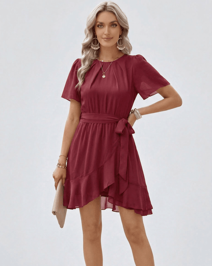 Mael Mini Dress in red satin, featuring a round neck and flutter design, perfect for casual outings, from RAMBLION.