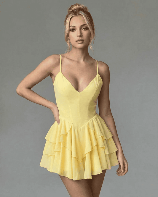 Marigold Mini Dress with V-Neck and Spaghetti Straps, featuring a tiered ruffle skirt in vibrant yellow.