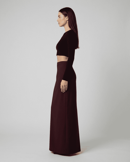 Merlot Maxi Skirt shown in side view, featuring high-waisted straight silhouette and elegant slit.
