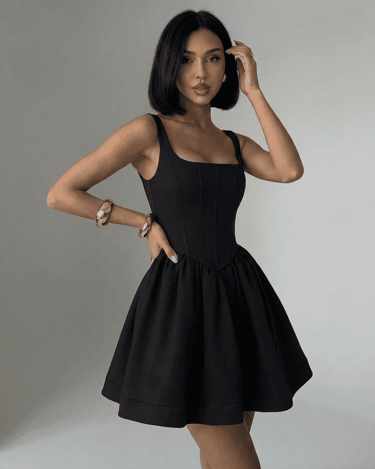 Nocturne Mini Dress on model, featuring a black structured corset design with a square neckline by RAMBLION.