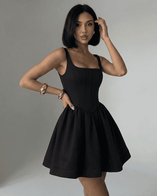 Nocturne Mini Dress on model, featuring a black structured corset design with a square neckline by RAMBLION.