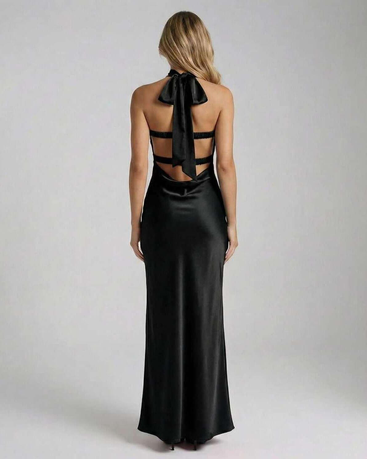 Elegant back view of the Noir Maxi Dress featuring a satin finish and unique bow detail.