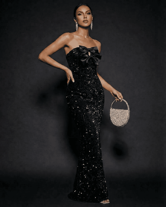 Noir Maxi Dress by RAMBLION, elegant strapless sequin gown with satin bows and glamorous profile.