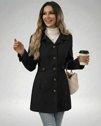 Woman wearing Noir Sculpt Jacket holding coffee, showcasing its slim fit and elegant design.
