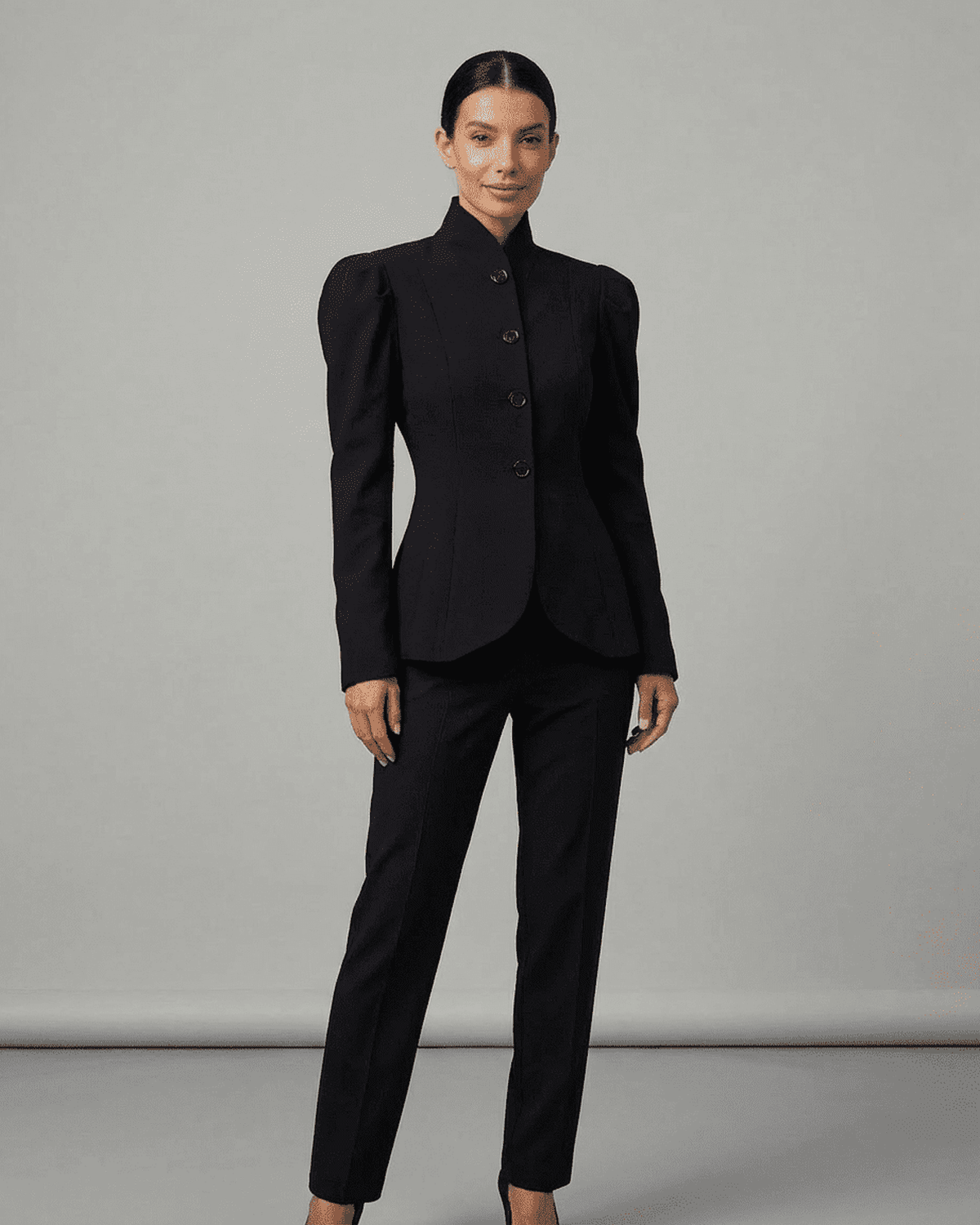 Noiré Blazer by RAMBLION worn by a model, featuring stand collar and structured puff sleeves.
