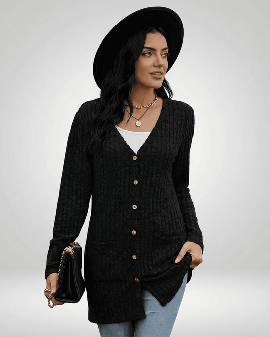 Nyx Cardigan by RAMBLION model wearing a stylish black button-front knit cardigan with long sleeves.