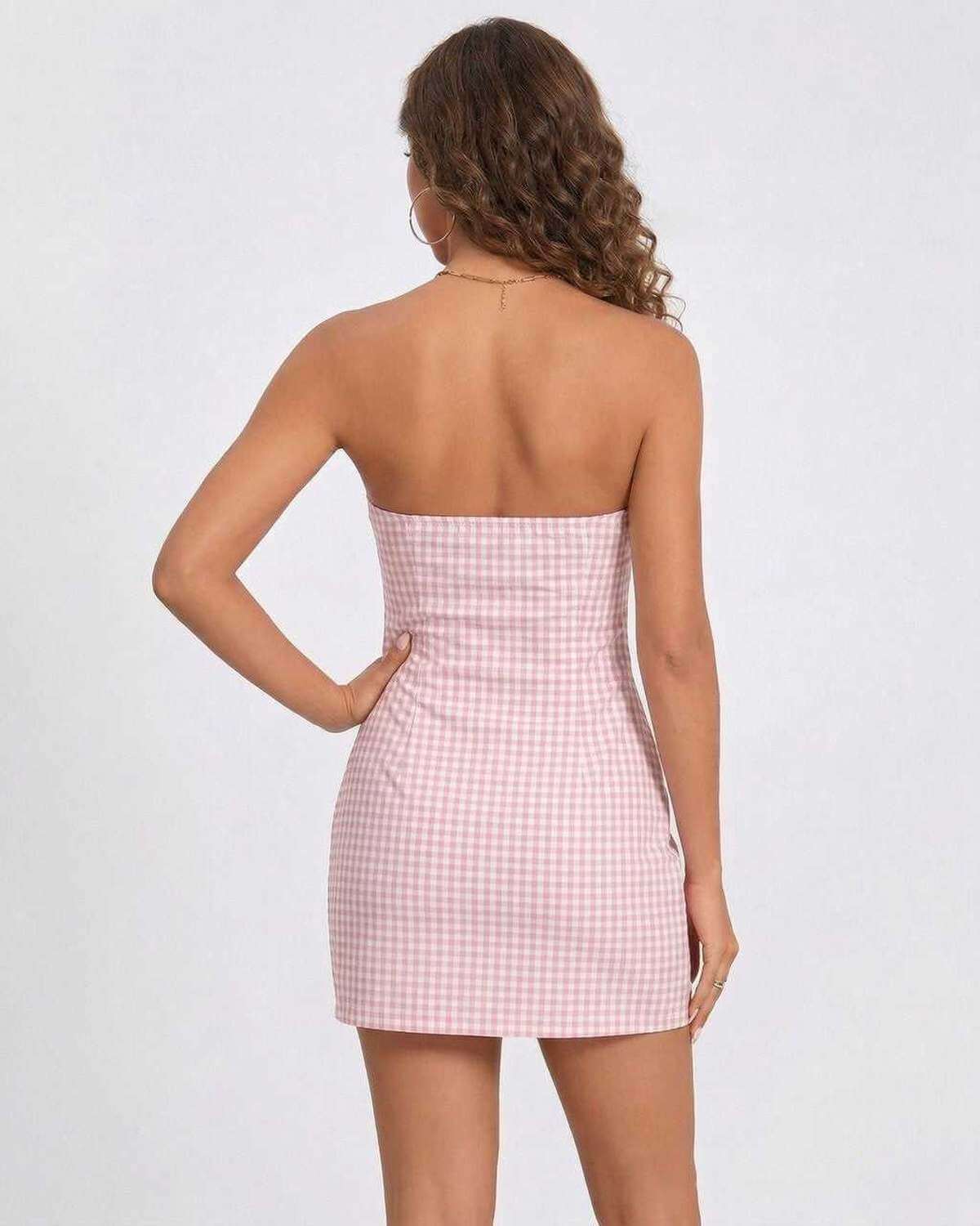 Model wearing a RAMBLION Metallic Mini Dress, strapless pink gingham design, perfect for summer occasions.