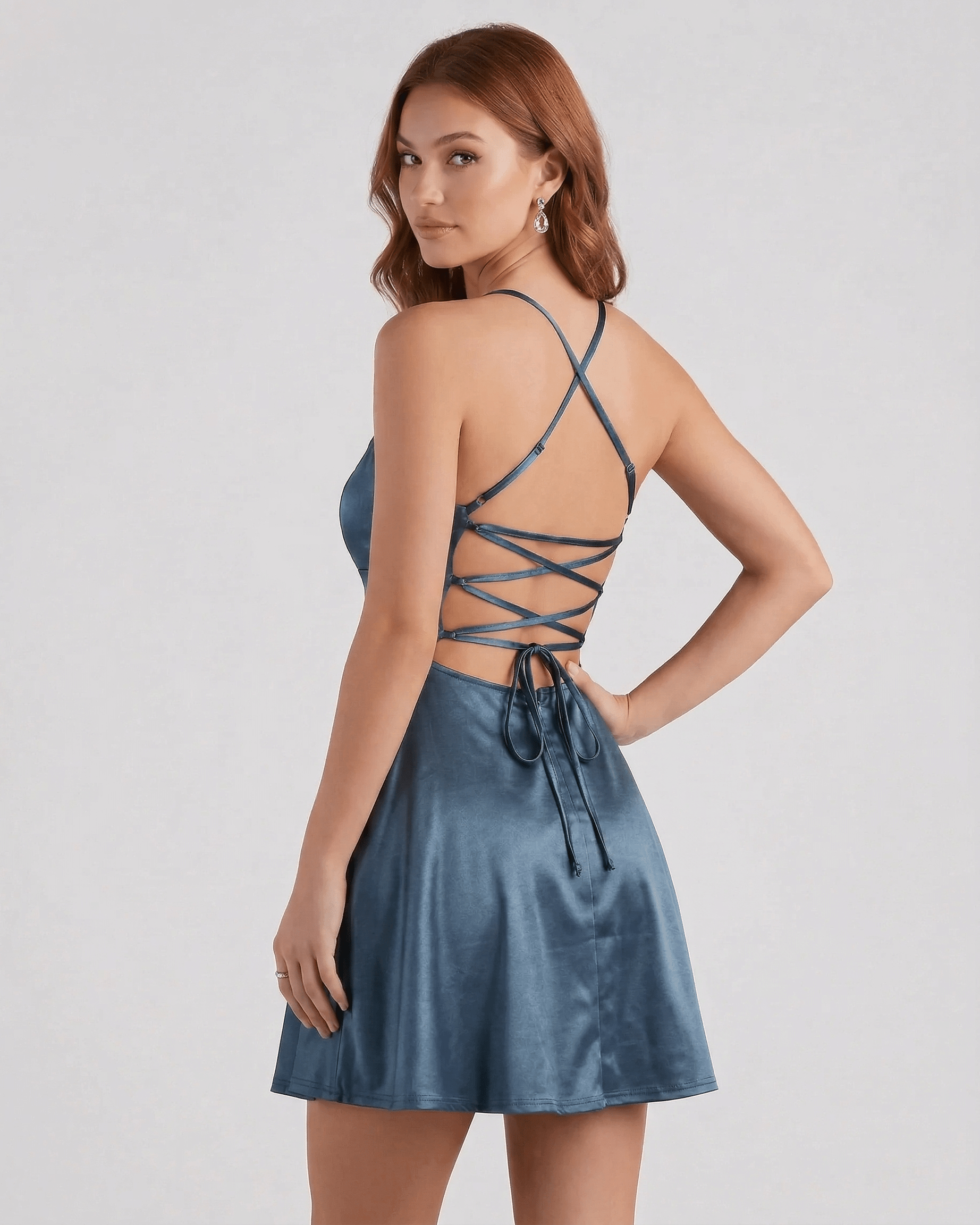 Roa Mini Dress in deep blue satin with a stylish lace-up back, perfect for evening parties by RAMBLION.