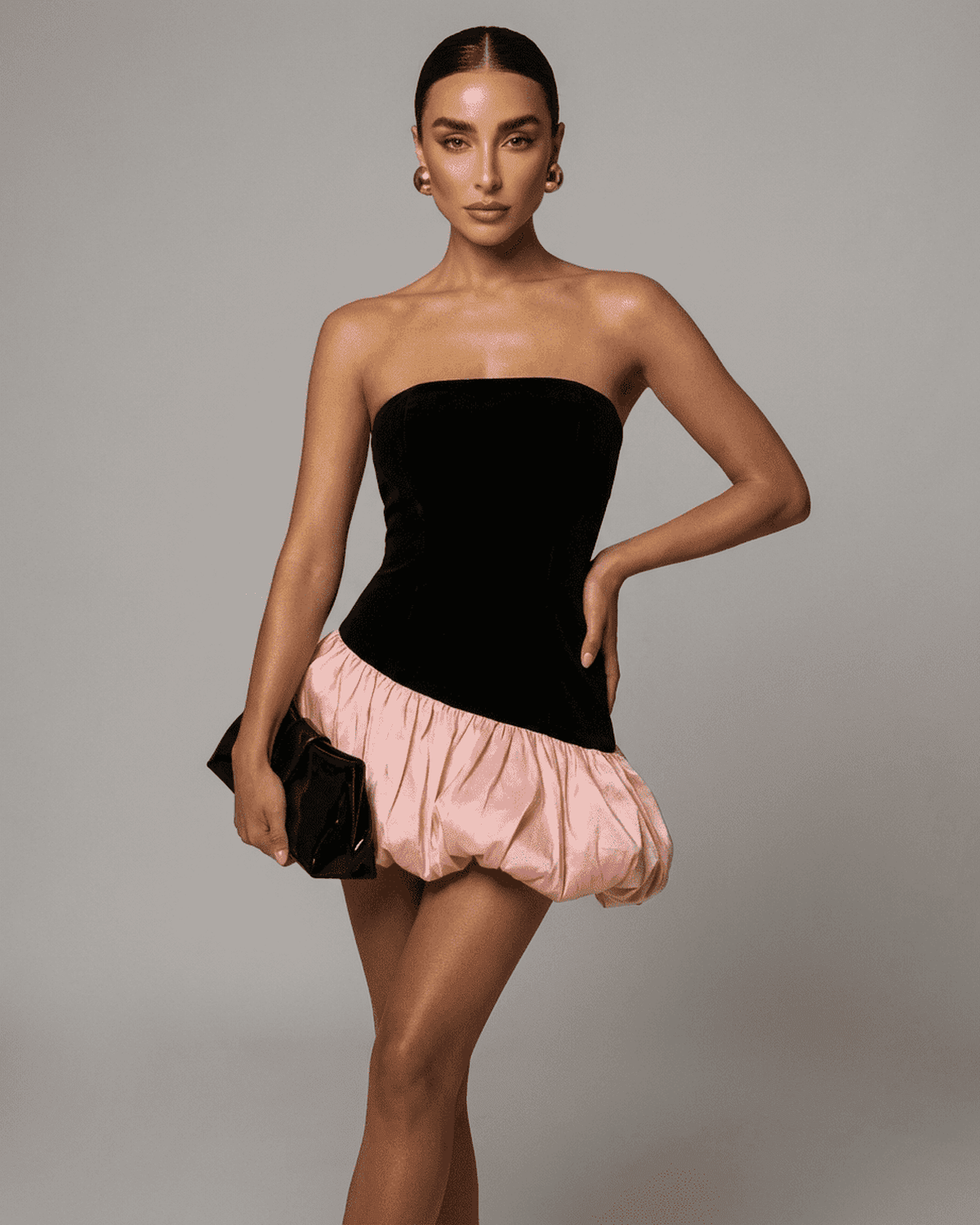 Selina Mini Dress in black velvet with pink puff skirt, by RAMBLION, showcasing a stylish strapless design.