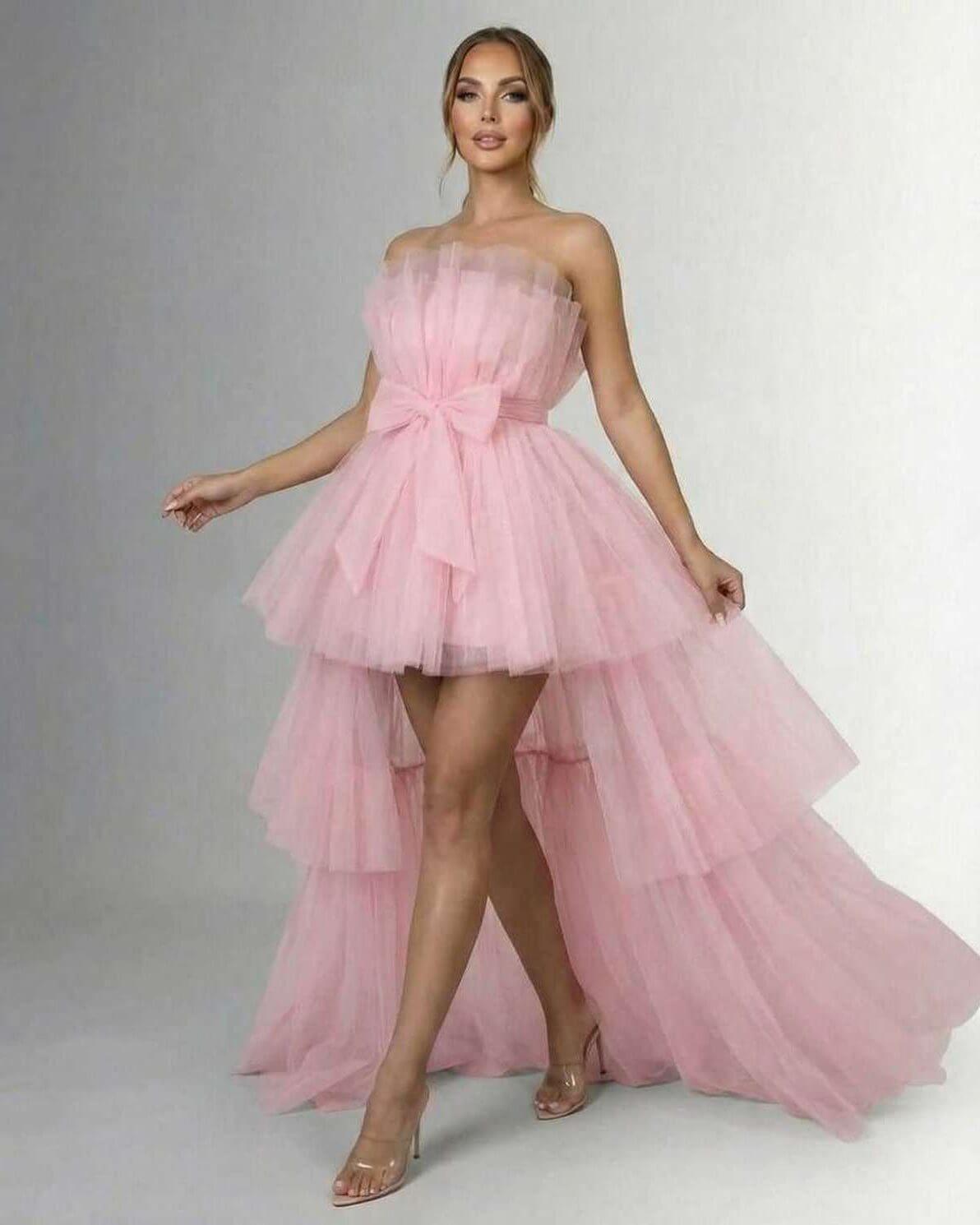 Seraphina Maxi Dress - Elegant strapless tulle gown with high-low hem and matching bow in soft pink.