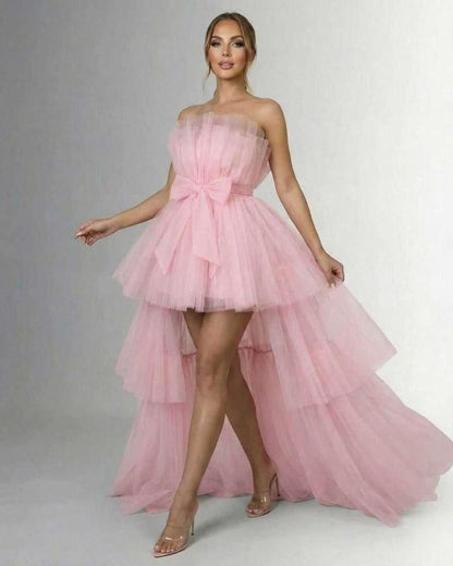 Seraphina Maxi Dress - Elegant strapless tulle gown with high-low hem and matching bow in soft pink.
