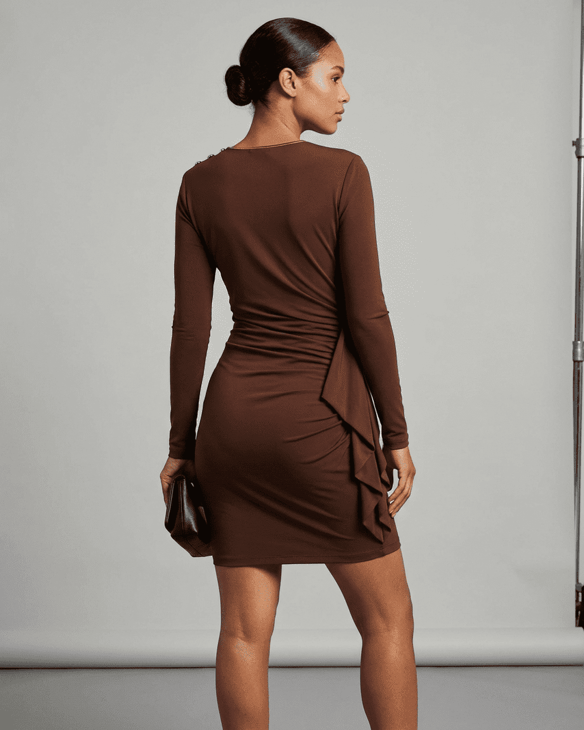 Sienna Mini Dress by RAMBLION: Brown bodycon mini dress with ruched detailing and round neckline, showcasing a sleek fit.
