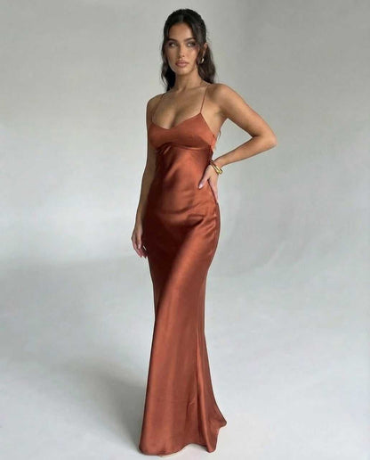Tara Maxi Dress in luxurious brown satin, featuring a V-neckline and spaghetti straps, perfect for elegant occasions, by RAMBLION.