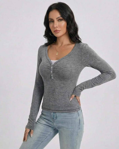 Toya Pullover featuring a refined V-neckline, soft grey fabric, perfect for layering by RAMBLION.