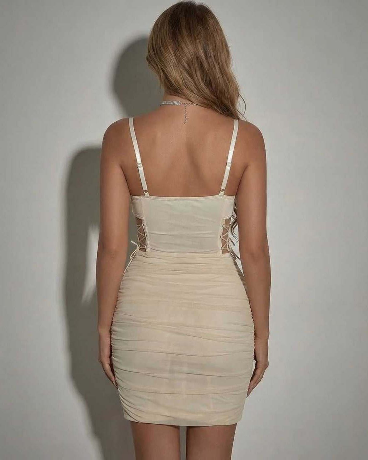 Udse Mini Dress back view showing sheer panels, chic pencil silhouette, perfect for summer occasions, by RAMBLION.