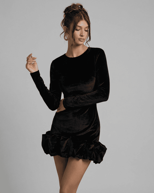 Velora Mini Dress Black by RAMBLION, featuring luxe velvet, long sleeves, and pleated hem design.