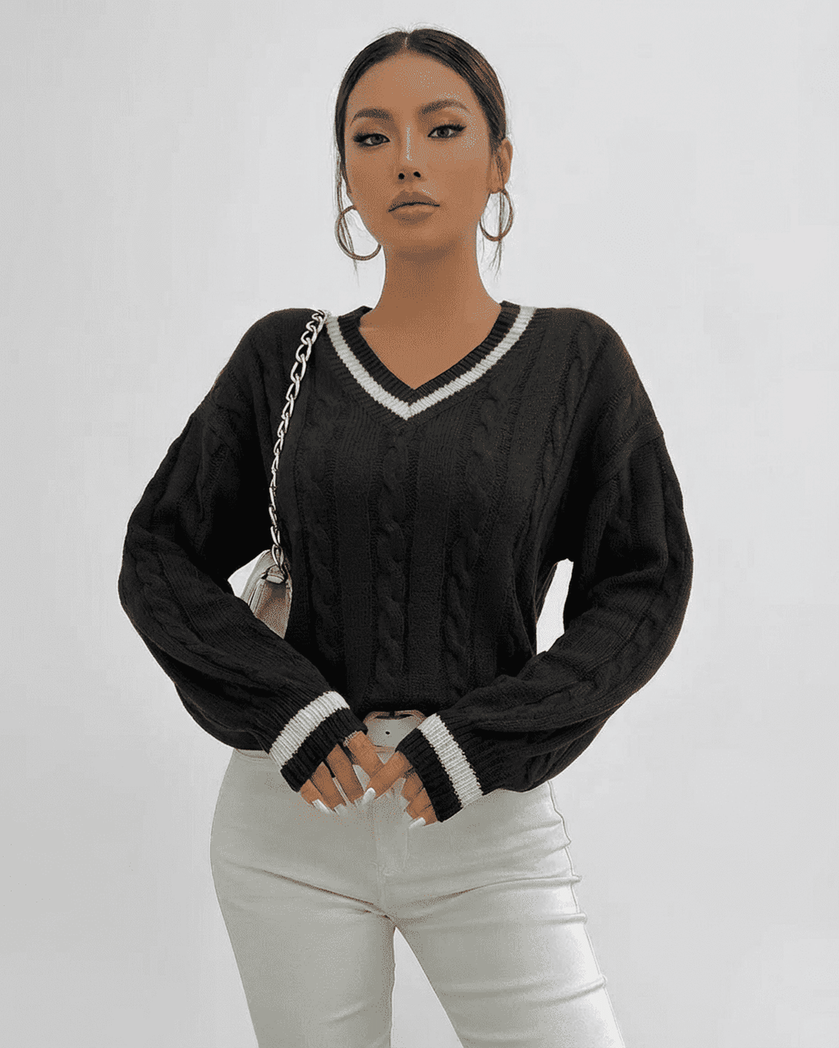 Verona Sweater by RAMBLION in black cable knit with V-neck silhouette, perfect for stylish layering.