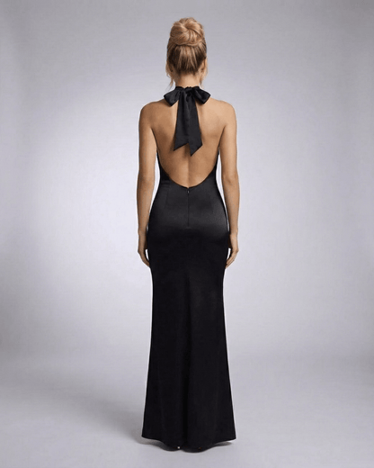 Roya Maxi Dress back view, black ankle-length satin halter dress by RAMBLION, perfect for elegant occasions.