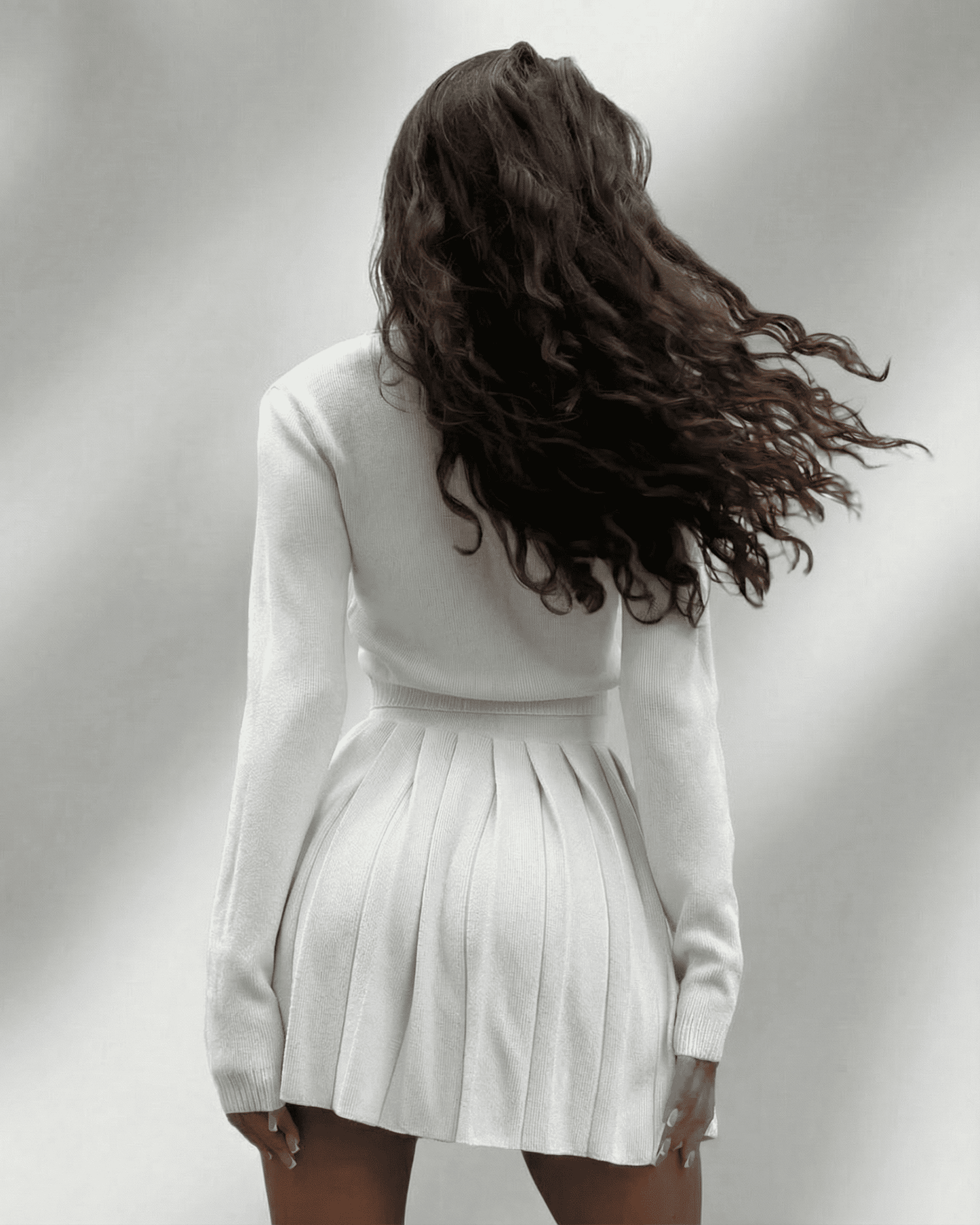 Rysa Set by RAMBLION featuring a white mini dress and cardigan, stylish for casual and elegant occasions.