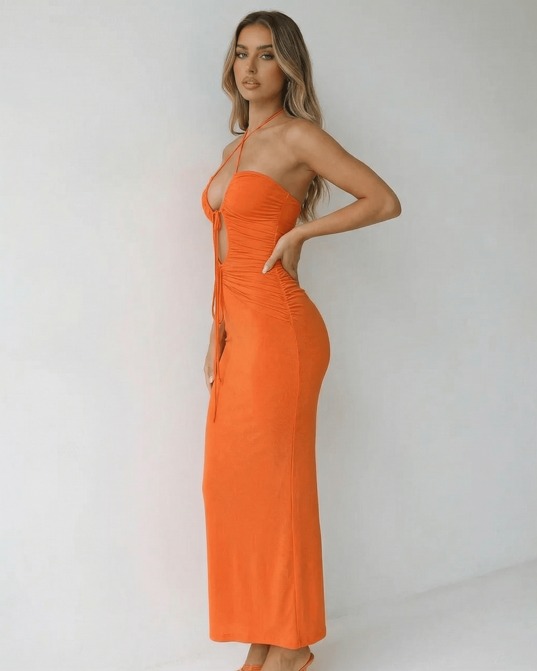 Sage Maxi Dress by RAMBLION, orange ankle-length halter dress for warm evenings, crafted from soft cotton.