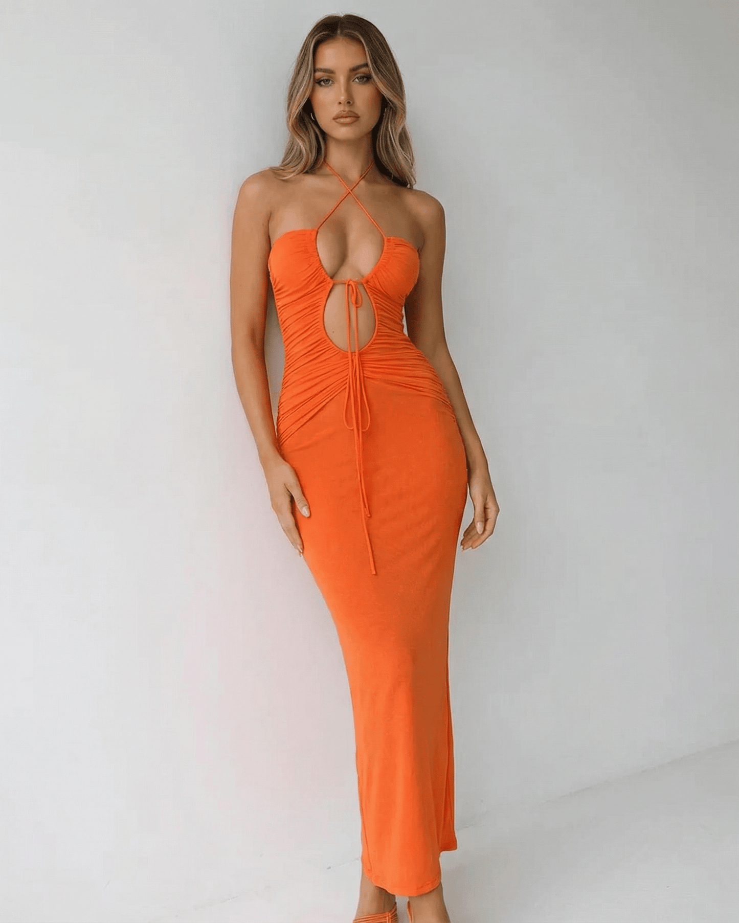 Sage Maxi Dress by RAMBLION, orange ankle-length, halter neck, perfect for warm evenings, stylish and modern.
