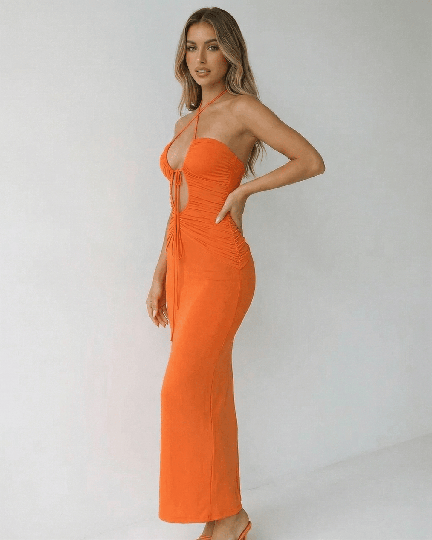 Sage Maxi Dress - Orange ankle-length halter dress by RAMBLION, ideal for warm evenings and casual outings.