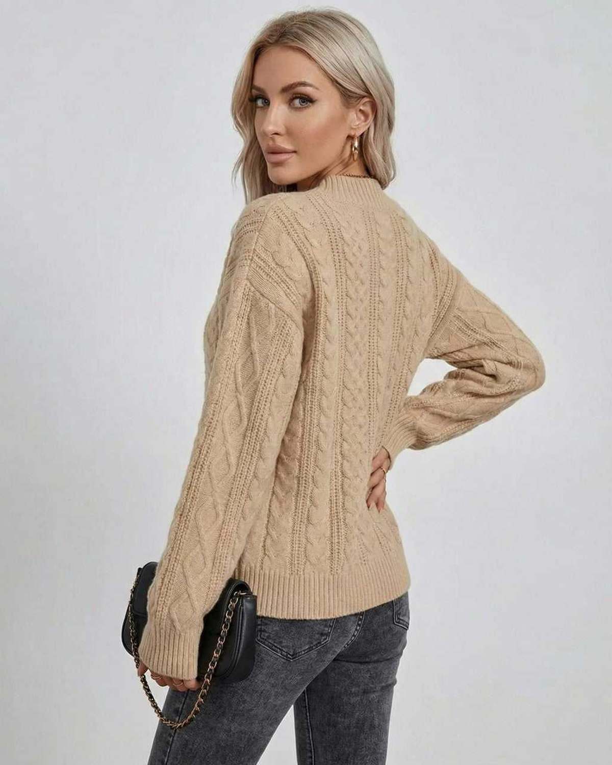 Sagi Sweater from RAMBLION, a beige cable knit piece perfect for Autumn and Winter, offering chic comfort and versatility.