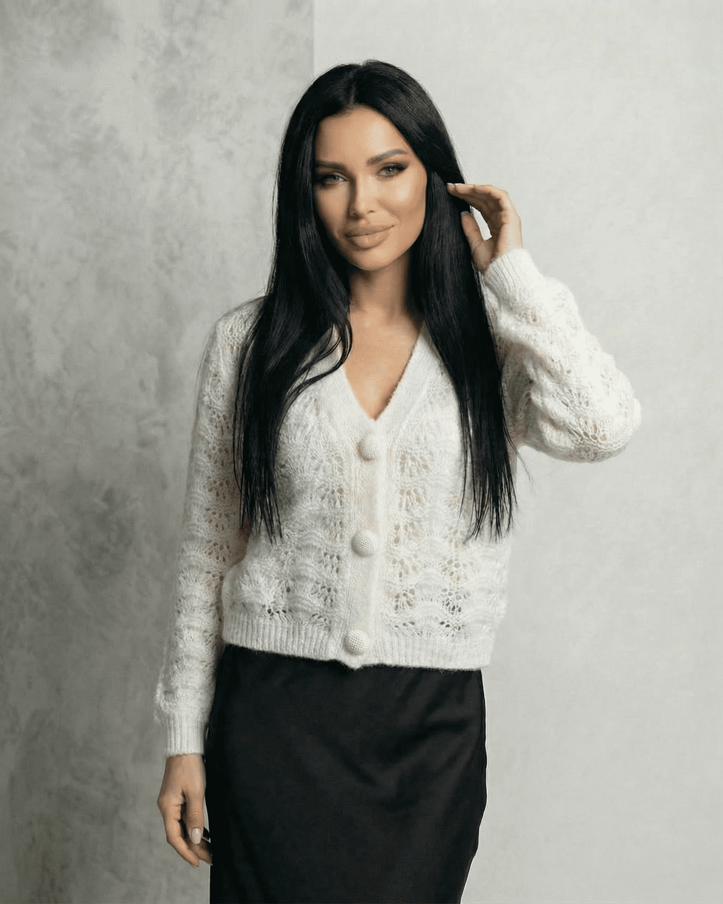 Serena Cardigan - Elegant lace knit V-neck button front cardigan in white, worn by a model.