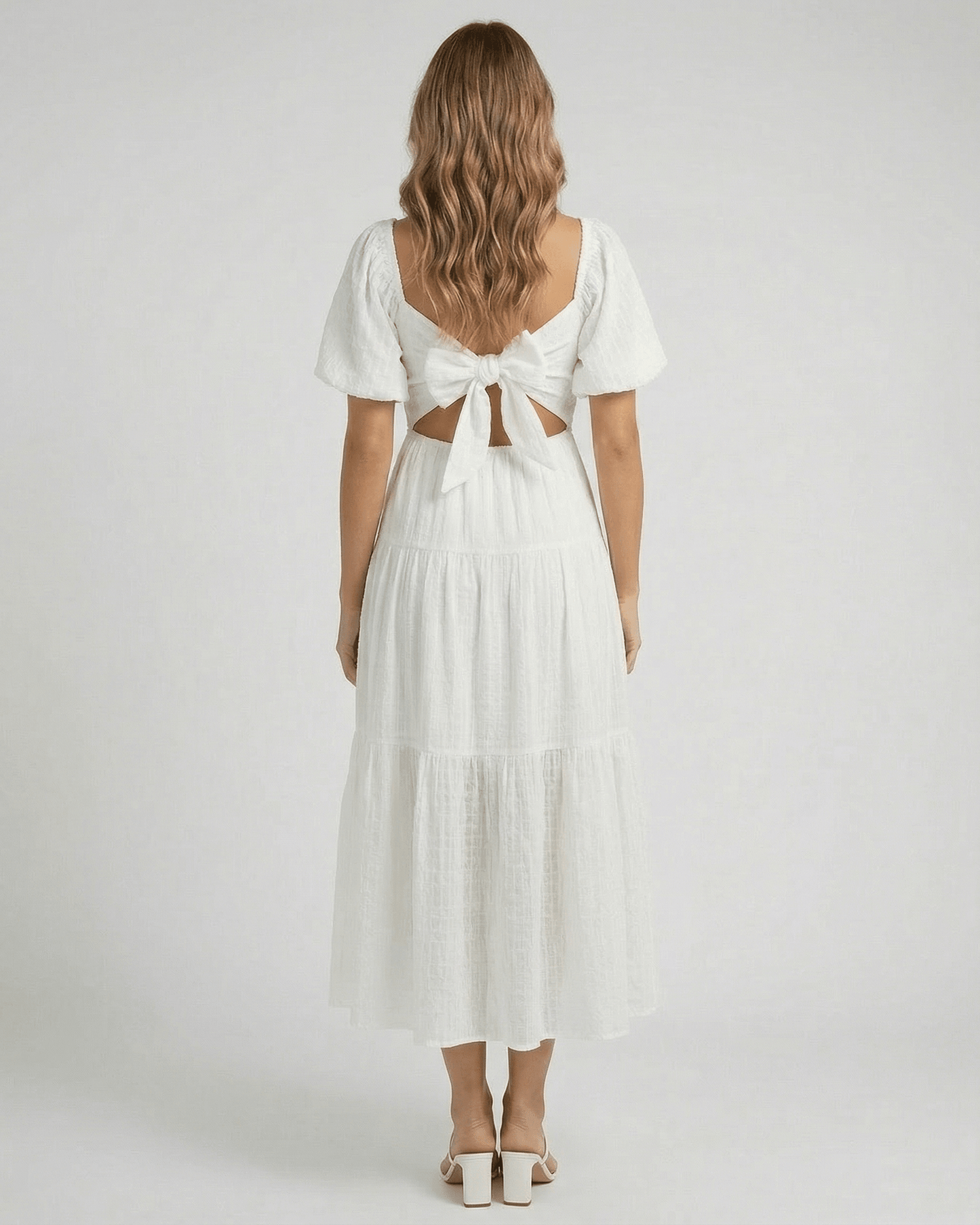 Sida Midi Dress by RAMBLION, elegant white cotton dress, back view with bow detail, perfect for summer occasions.