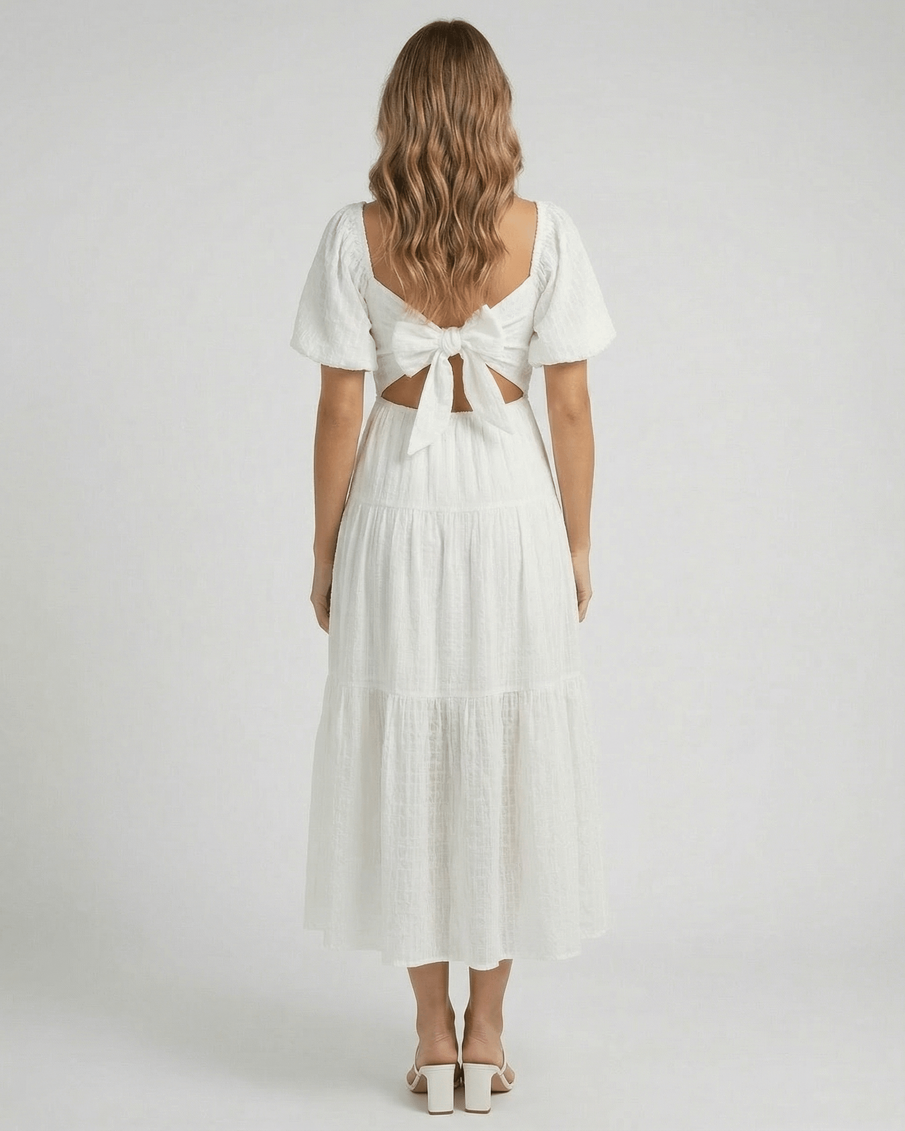 Sida Midi Dress by RAMBLION, elegant white cotton dress, back view with bow detail, perfect for summer occasions.