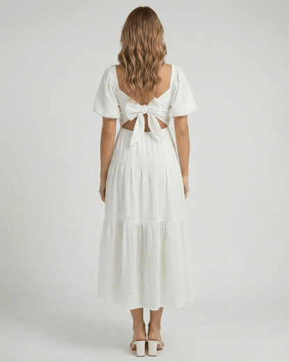 Sida Midi Dress by RAMBLION, elegant white cotton dress, back view with bow detail, perfect for summer occasions.