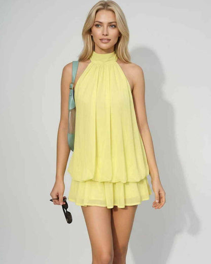 Ramblion Solina mini dress — tie-neck neckline · back view · styled for prom season