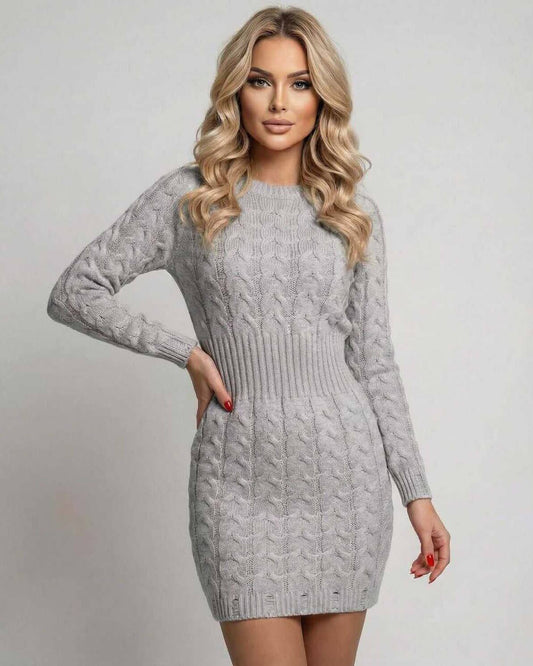 Model wearing Sterling Mini Dress, a soft gray cable knit sweater dress with long sleeves and O-neck.