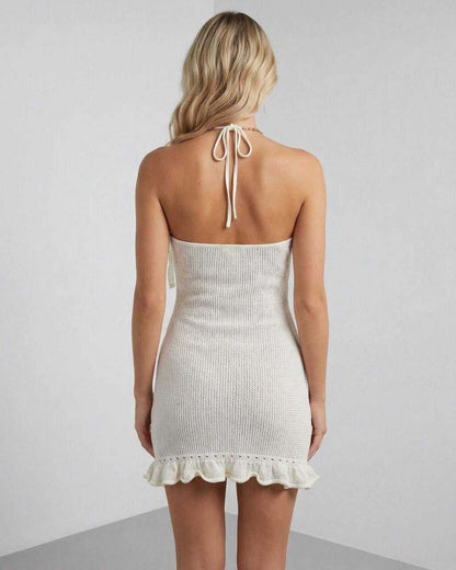 Tahe Mini Dress back view, white halter design with playful ruffles, perfect for summer occasions by RAMBLION.