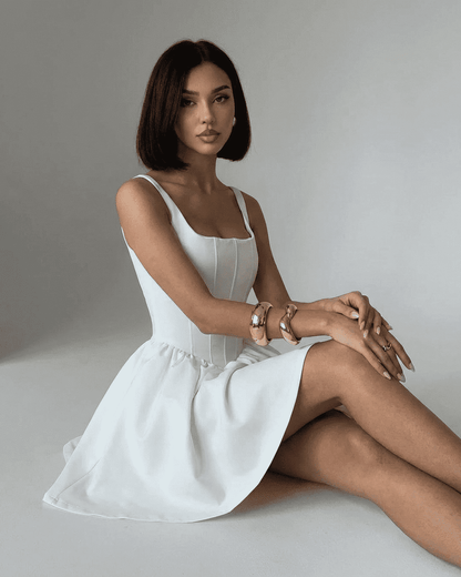 Tara Mini Dress by RAMBLION, white polyester satin, structured corset-style, chic modern aesthetic, perfect for special occasions.