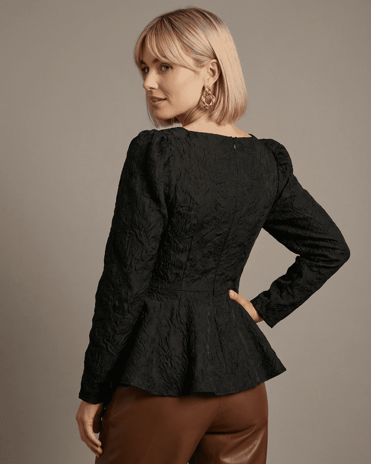 Tina Blouse back view featuring jacquard texture, peplum style, made by RAMBLION, ideal for sophisticated occasions.