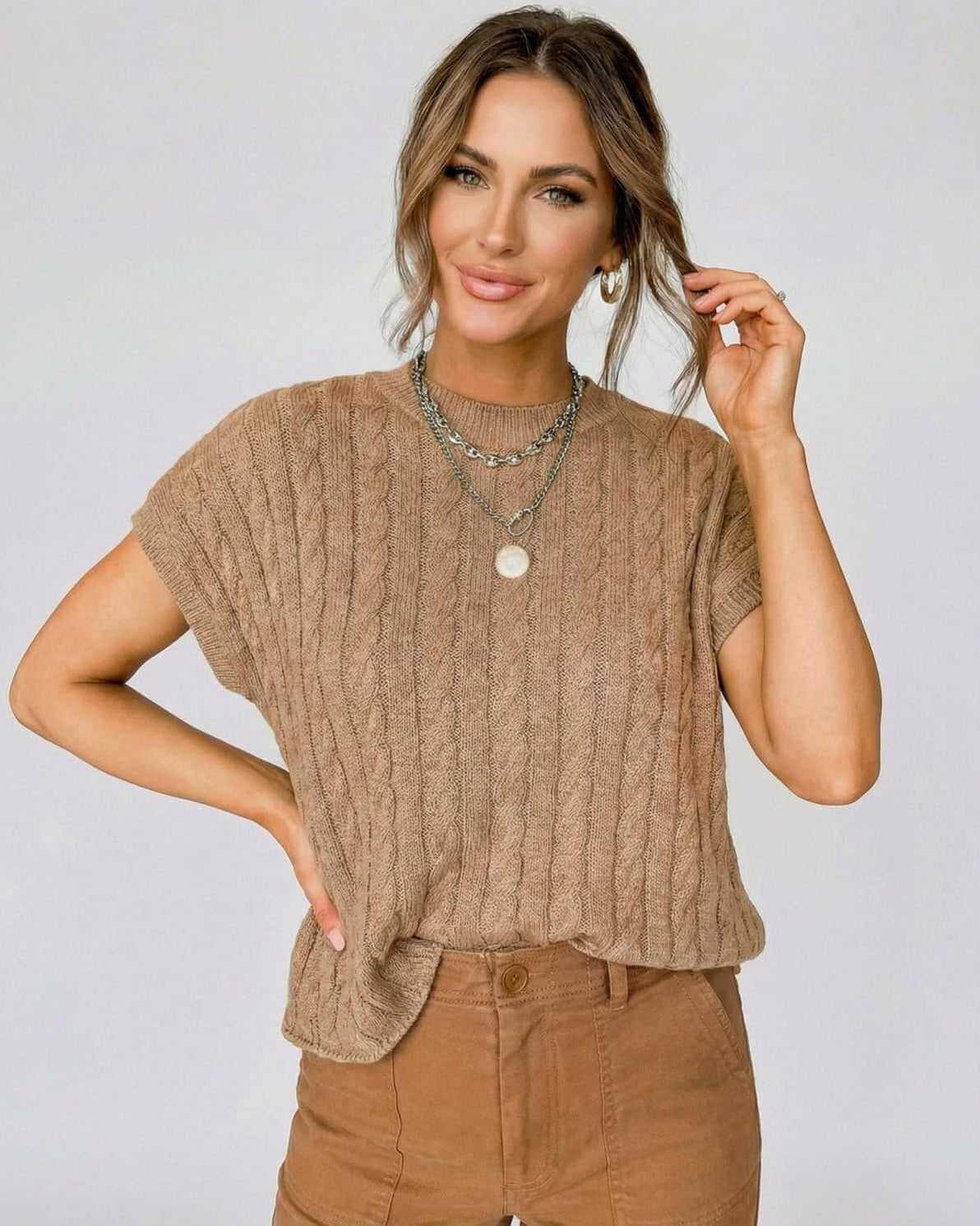 Toscana Sweater in cable knit style on model, featuring relaxed elegance and short sleeves by RAMBLION.