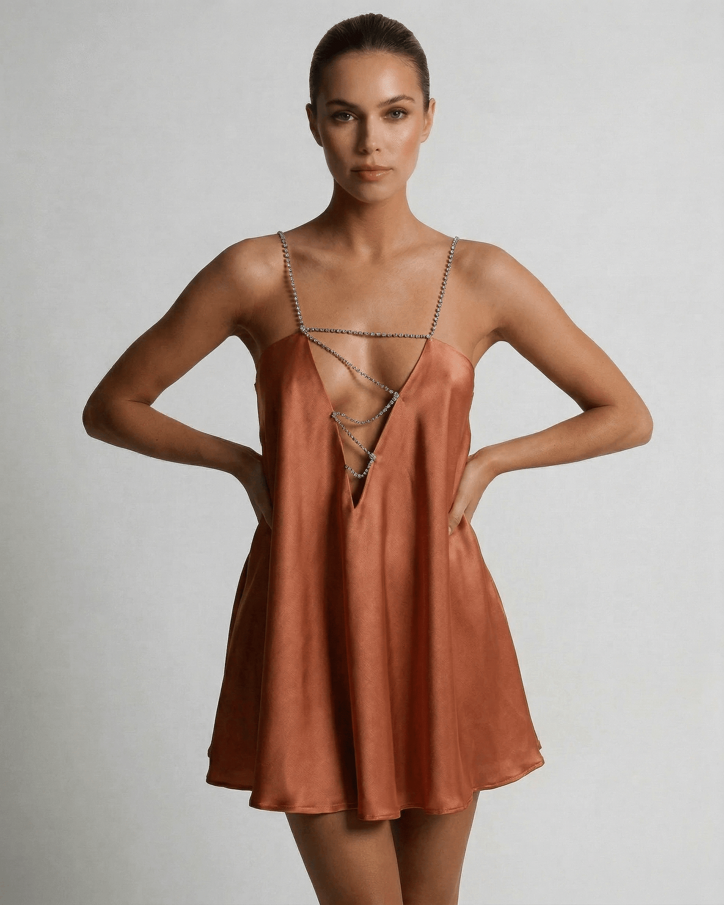 Uma Mini Dress by RAMBLION, gold satin with rhinestone straps, A-line silhouette, perfect for elegant occasions.