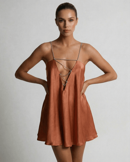 Uma Mini Dress by RAMBLION, gold satin with rhinestone straps, A-line silhouette, perfect for elegant occasions.