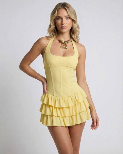 Vava Mini Dress featuring a square neck, tiered ruffle skirt, in soft yellow, perfect for warm-weather events by RAMBLION.