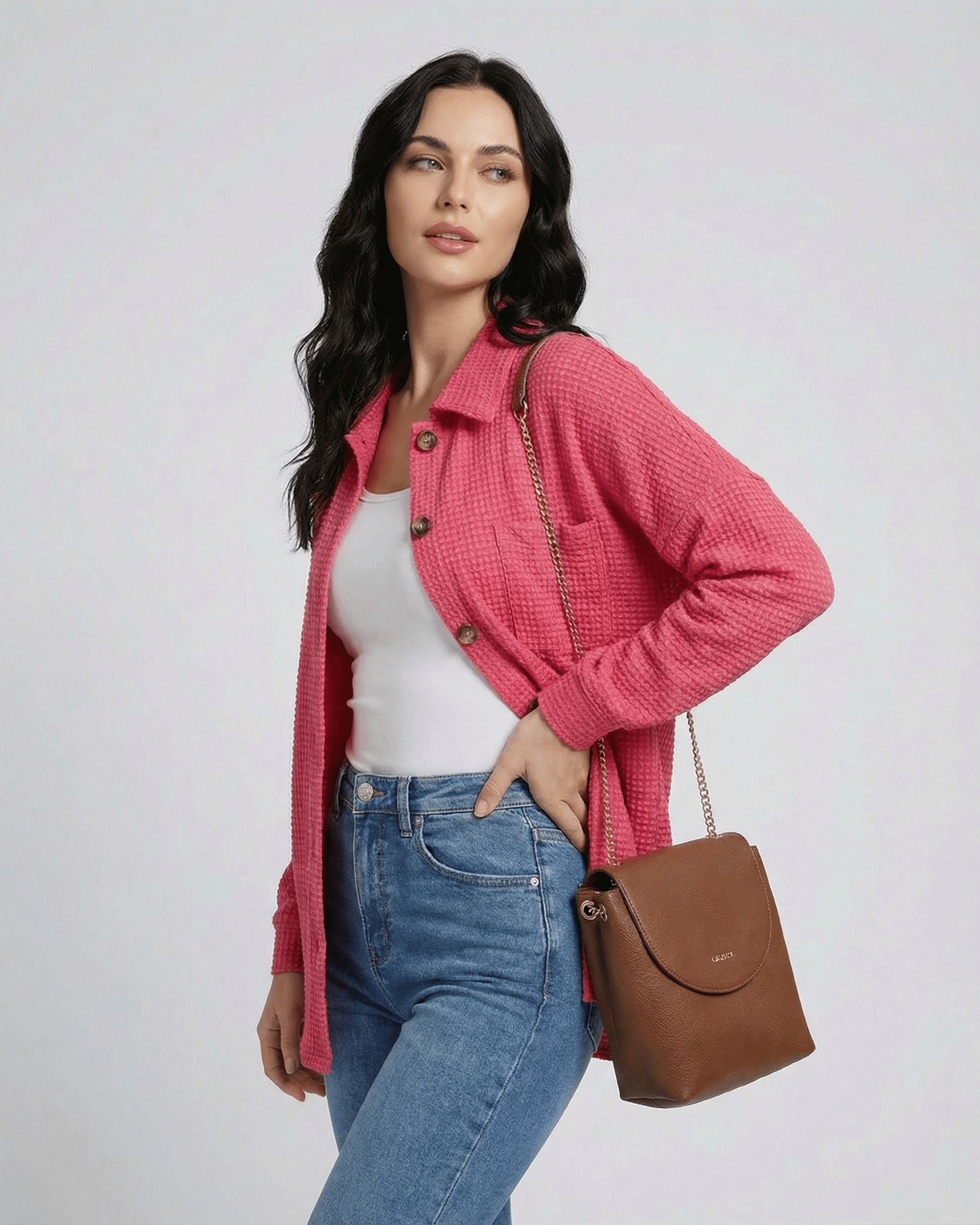 Verona Jacket – Women’s Pink Jacket in Waffle Knit by RAMBLION, styled with casual jeans and handbag.