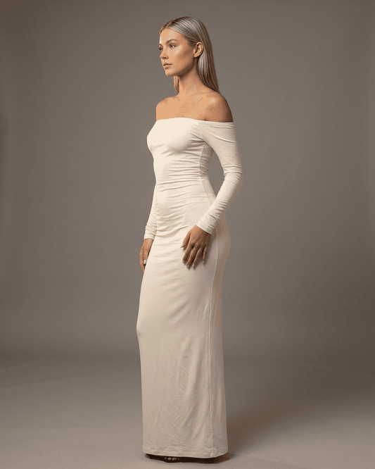 Via Maxi Dress, white ankle-length, off-shoulder silhouette, chic slash neckline, RAMBLION brand, effortless comfort.