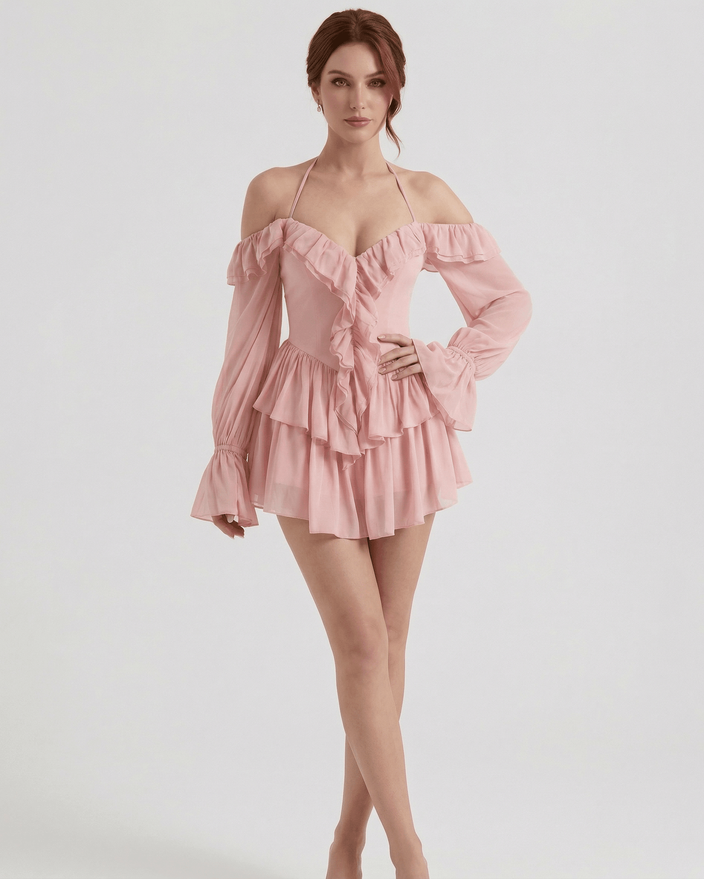 Waga Mini Dress in pink satin features ruffles and an elegant silhouette, perfect for romantic occasions by RAMBLION.