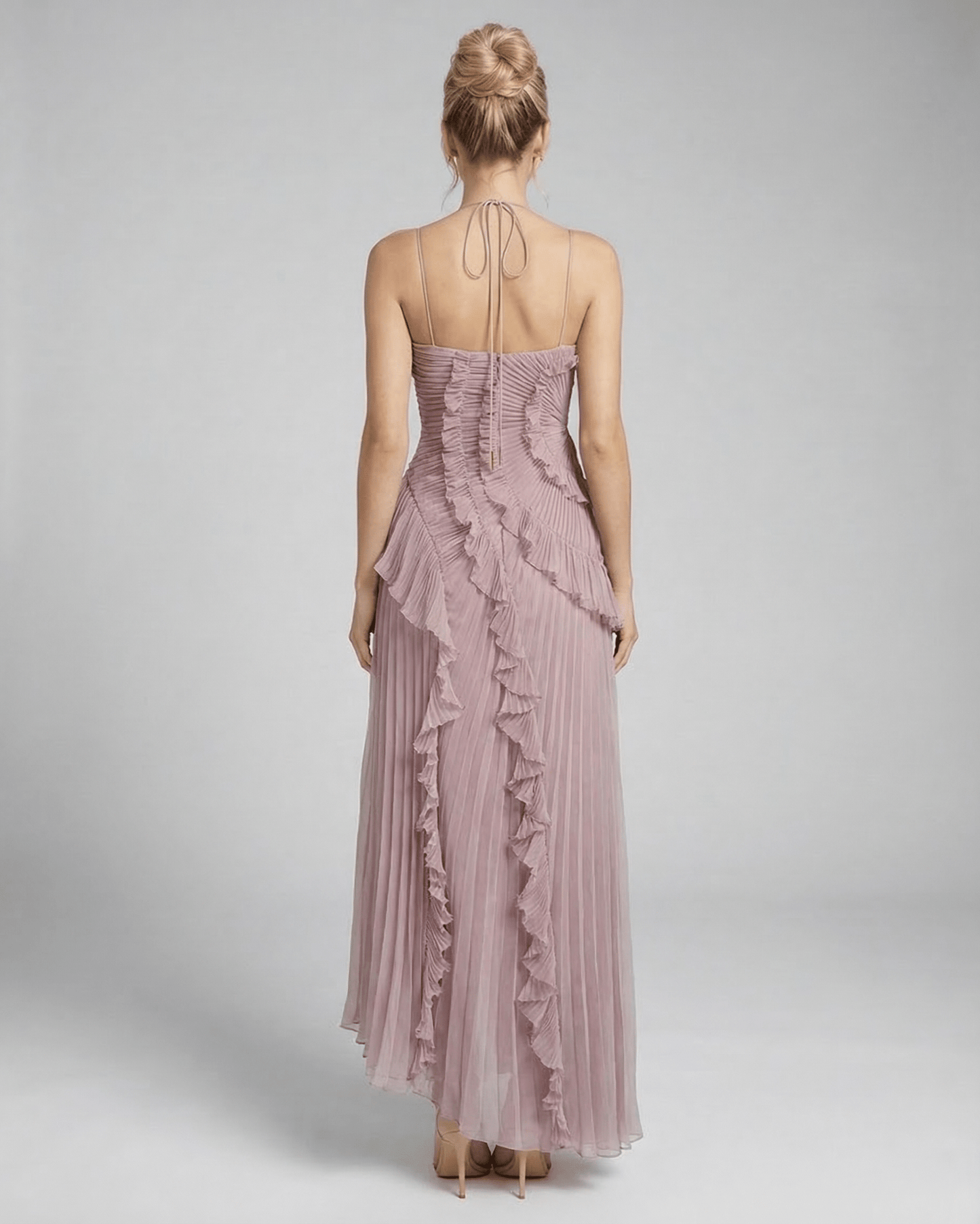 Wana Maxi Dress featuring a halter neck and ruffle accents in soft pink, perfect for elegant occasions. RAMBLION brand.