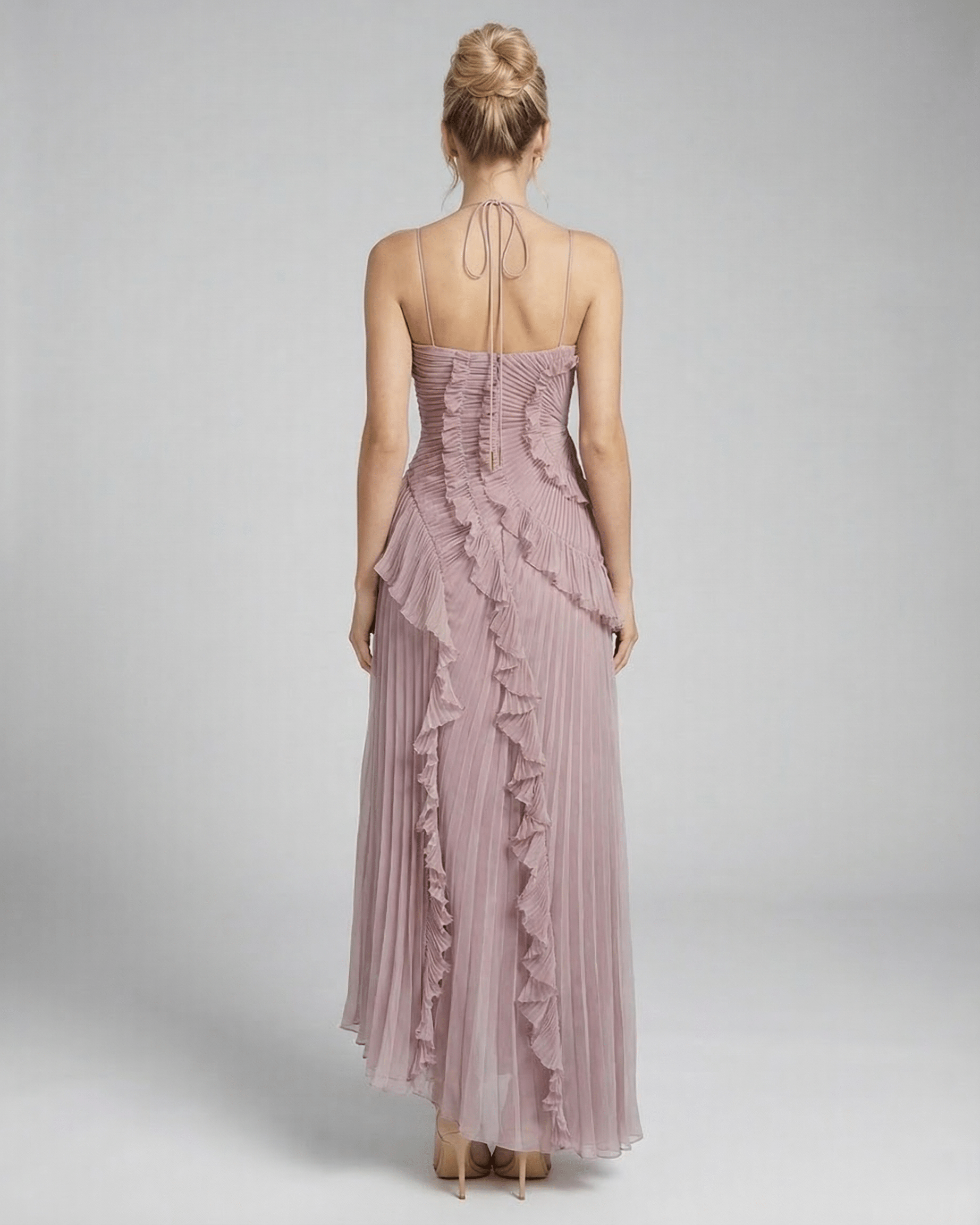 Wana Maxi Dress featuring a halter neck and ruffle accents in soft pink, perfect for elegant occasions. RAMBLION brand.