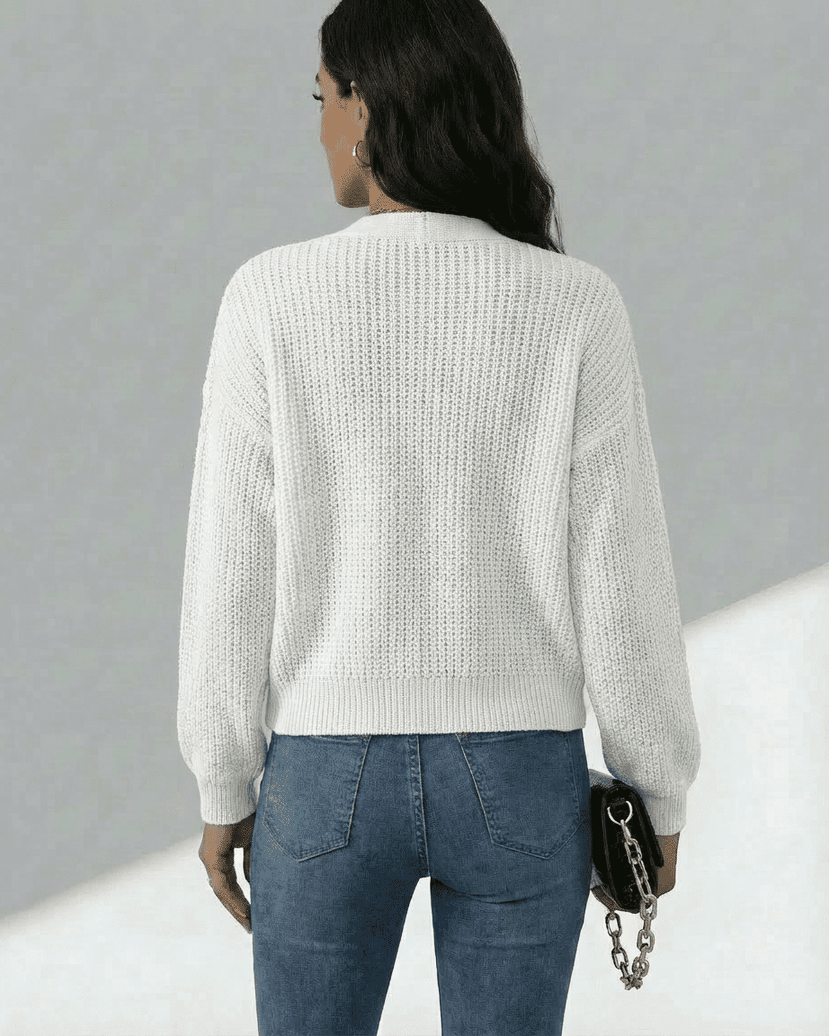Back view of the Wema Cardigan, a lightweight knit women's cardigan by RAMBLION, showcasing breathable comfort and a stylish feel.