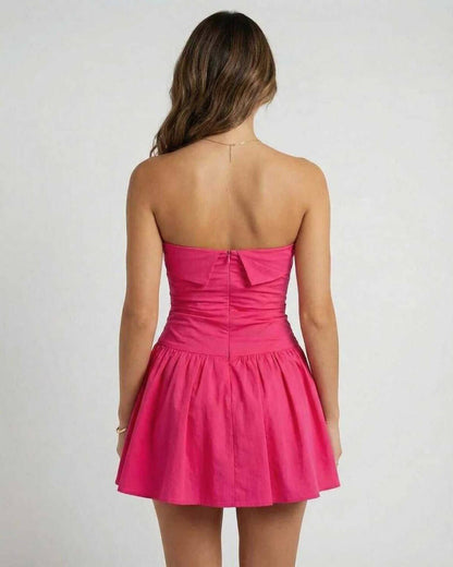 Wira Mini Dress: Strapless pink mini dress with flared skirt by RAMBLION, perfect for summer outings.