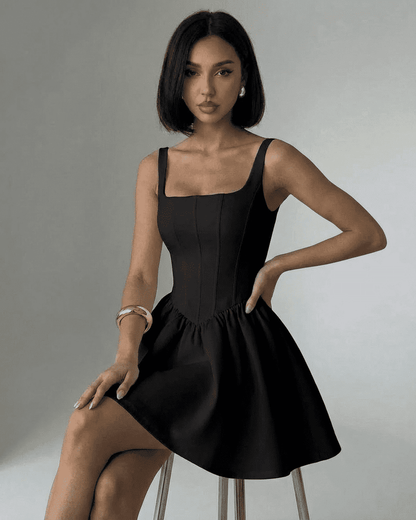 Xana Mini Dress in black satin; square neck, corset-inspired bodice, perfect for elegant occasions, by RAMBLION.